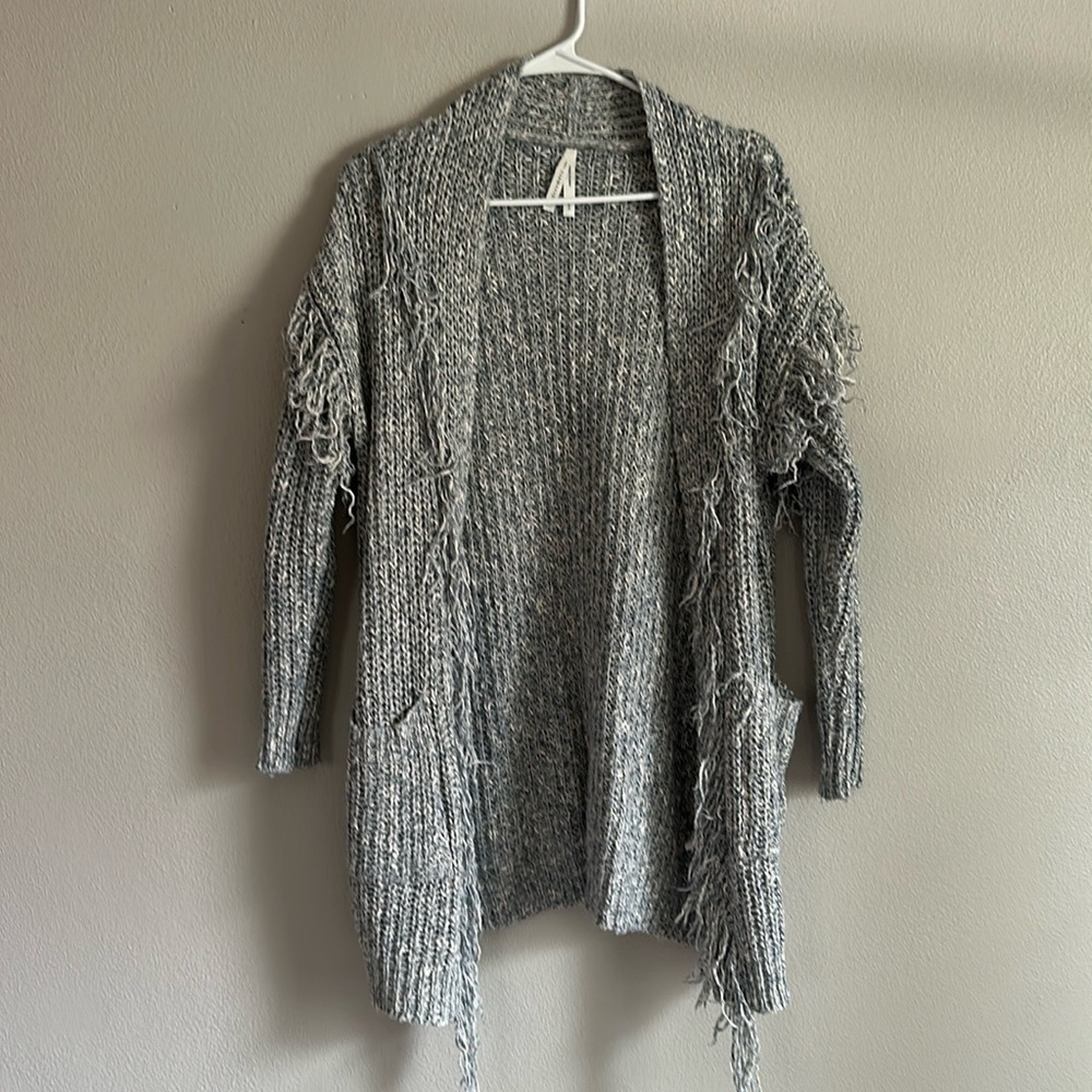 Light blue sweater with fringe detail